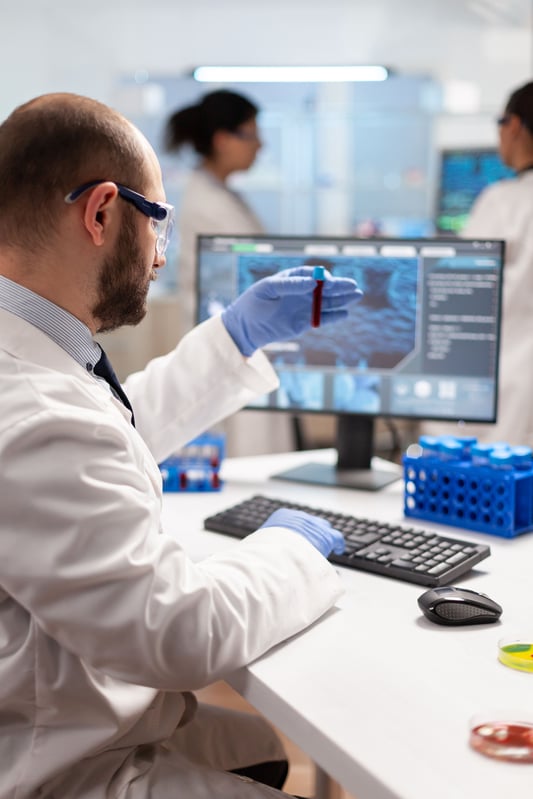 genetic-scientist-studying-epidemics-holding-sample-blood (1)