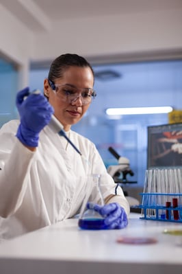 physician-researcher-dropping-liquid-medical-glassware-using-micropipette-analyzing-coronavirus-vaccine-expertise-biologist-specialist-doctor-working-pharmacology-hospital-laboratory-min
